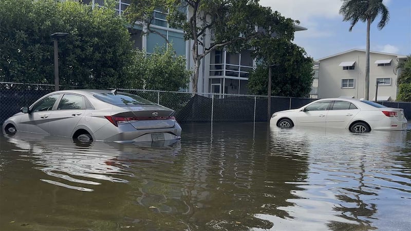 Floodwaters inundated parking spaces, roads and walkways at the Coastal Towers Condominium...