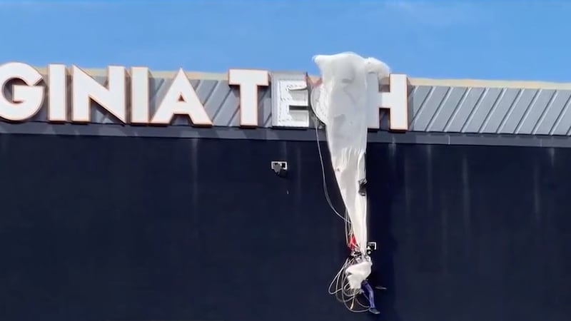 A skydiver crashed into the Virginia Tech scoreboard and was left dangling from the top of it...