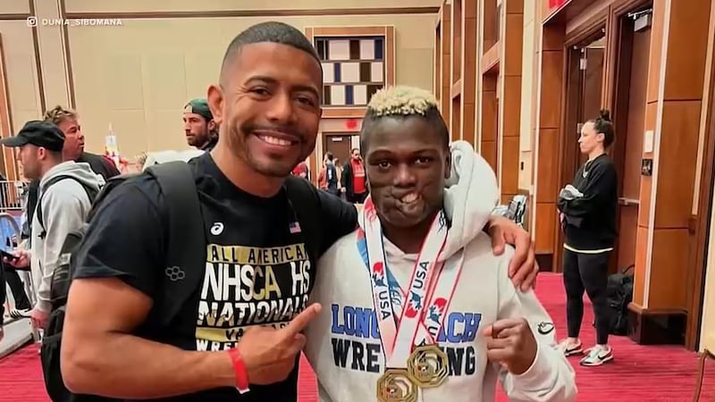Dunia Sibomana-Rodriguez (right) has became a high school wrestling star years after he...